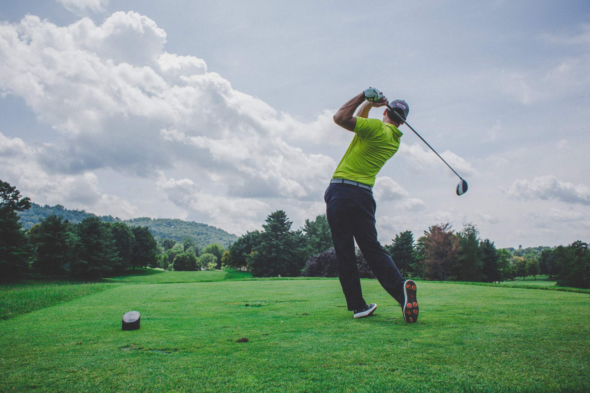 Golfer finishing his swing.